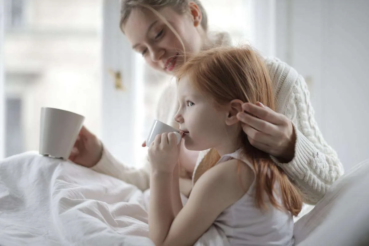 A mother giving her child alternative drink to mushroom coffee as it is not adviced by the experts.