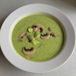 Creamy zucchini and mushroom soup on a plate
